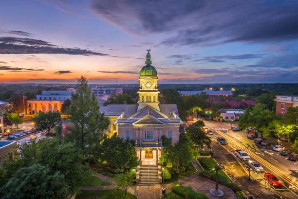 Historic Athens, GA courthouse at sunset, showcasing architectural details and vibrant sky, symbolizing community charm and local heritage.