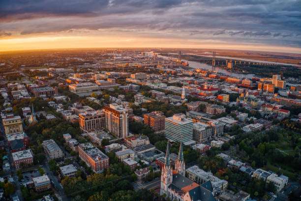 Aerial view of Augusta, GA, showcasing city architecture, tree-lined streets, and a sunset sky, highlighting the area's residential and commercial structures relevant to home improvement and construction services.