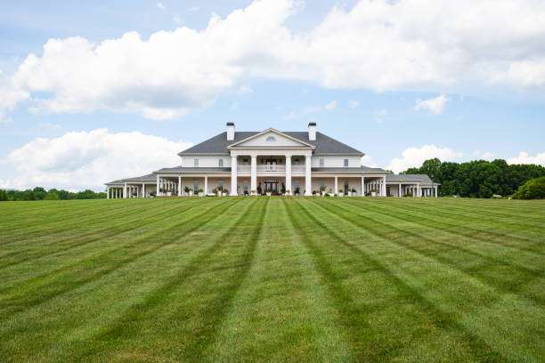 Elegant residential home with a spacious lawn, showcasing a classic architectural style, ideal for roofing services in Cleveland, GA by Artisan Roofing & Construction.