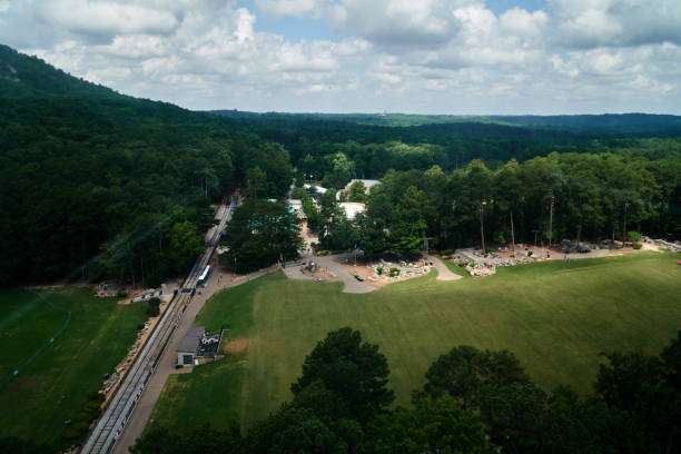 Aerial view of a lush green park in Jefferson, GA, featuring walking paths, trees, and recreational areas, highlighting the community's outdoor spaces and family-friendly atmosphere.